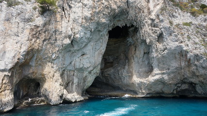 Cliff scenery and rock formations on the island of Capri in the Bay of Naples, Italy. Photographed whilst on a boat trip around the island.