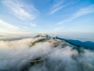 Obraz premium Wind power generator before sunrise sunset ，Wind power generation in the sea of clouds