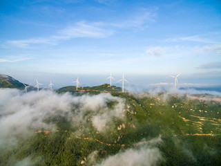 Wind power generator before sunrise sunset ，Wind power generation in the sea of clouds