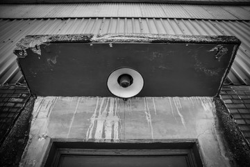 old abandoned factory warehouse entryway door and overhead light