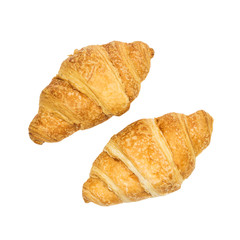 Fresh croissants isolated on white background. Top view. File contains clipping path.