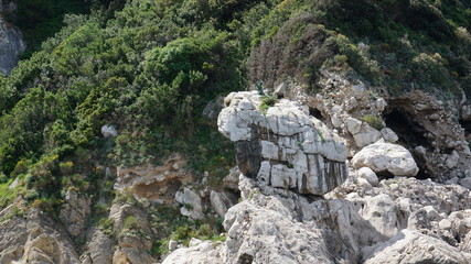 The little Mermaid statue on a rock of the island of capri