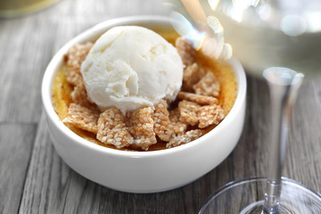 Dessert of cream brulee with ice cream and sesame in caramel.