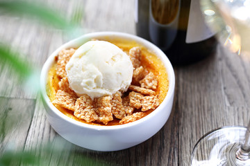 Dessert of cream brulee with ice cream and sesame in caramel.