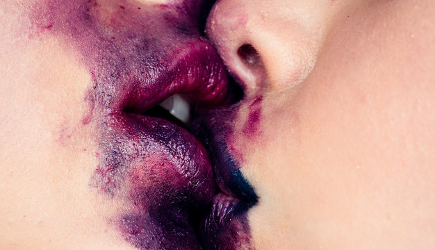 Lesbian couple kiss lips. Passionate kissing. Lipstick and lipgloss. Romantic dirty young lesbian couple kissing.