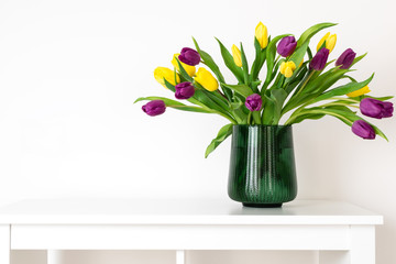 Minimal composition, scandinavian nordic hygge style, home interior, mother day - tulips in green vase