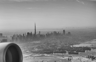 Aerial view of Downtown Dubai from the airplane at sunrise