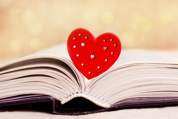 Book revealed, Bible, with a red heart. I like to read the Bible_