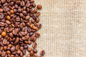 Coffee grains on burlap. The background of coffee beans_