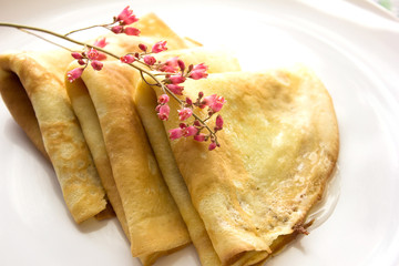 Tasty crepes with caviar. French crepes, russian or ukrainian on white background. Maslenitsa holiday food