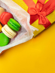 Colorful macaroons. Sweet macaroons on color background with copy space. Top view, Holiday time concept
