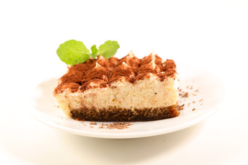 delicious tiramisu cake portion on white background