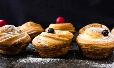 Modern fashionable pastries - scones cruffins (puffmaffin) a mixture of a croissant and maffin