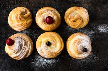Modern fashionable pastries - scones cruffins (puffmaffin) a mixture of a croissant and maffin
