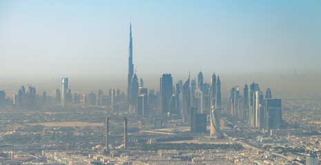 Aerial view of Downtown Dubai from the airplane at sunrise