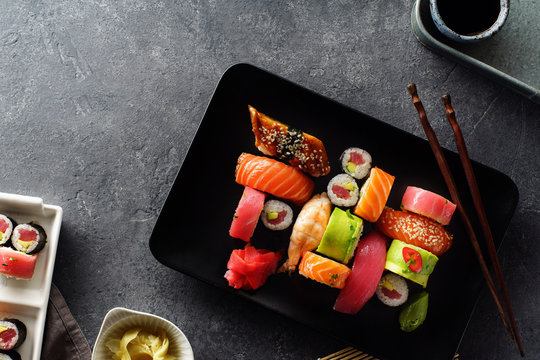 Overhead image of variety of sushi and rolls served on a plate. Shrimp, unagi, crab, salmon and tuna