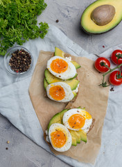 Sandwich on grain bread with boiled egg and avocado