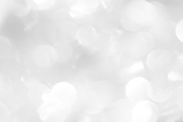 A brilliant white background with circles and ovals. Template for a holiday card with bright and sparkling lights.