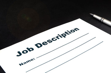 Blank form Job description with pen on black background.