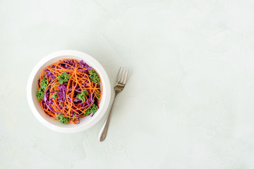 Kale, red cabbage, carrot salad. Healthy eating, vegan food