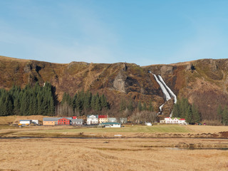 Systrafoss waterfall and kirkjubaejarklaustur village, south Iceland in winter