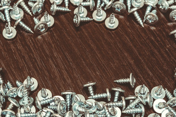 screws on the table, a slide of small bolts