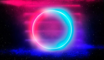 Neon circle, neon lights. Neon circle with the center of a dark empty scene with spotlights. Abstract light. Night view.