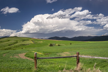 Storm clouds are building over the mountains near Lewistown in central Montana