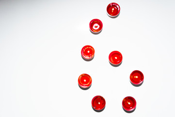 Numbers made of colored candles, tealight on blank, isolated background