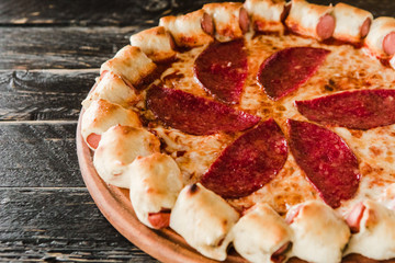 tasty unusual pizza with sausage in a side