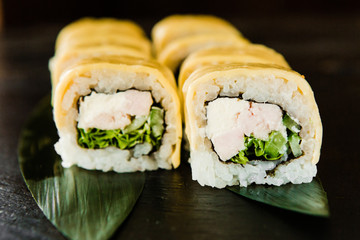 rolls with fresh fish, vegetables and cream cheese