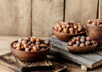 Hazelnuts on rustic wooden background. Food background. Print for kitchen