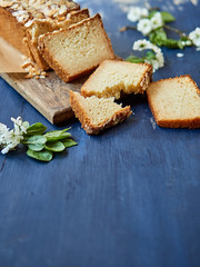 Sliced almond pound cake on a wooden board