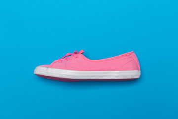 Pink Sneakers on blue. Photo. Interior poster