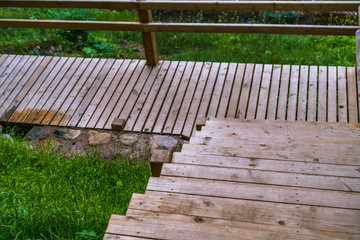 Fototapeta premium Colorful Photo of the Park on a Sunny Autumn day - Wooden Bridge in the Middle of it