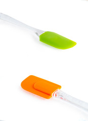 Different color silicone spatula for cooking on an isolated white background