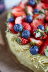 Side of a frosted pistachio cake