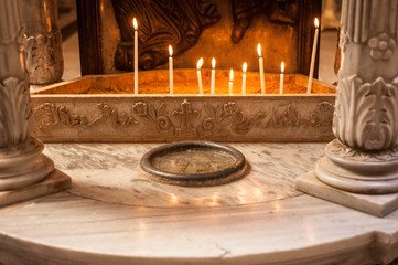Jerusalem. Interior orthodox church.Burning candles.