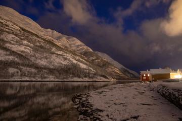 Part of old town by the river Vefsna at night