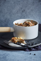 Rice dish with lamb ribs in a white pot
