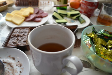 cup of tea and cookies on table