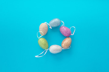decorative easter eggs on blue textural background