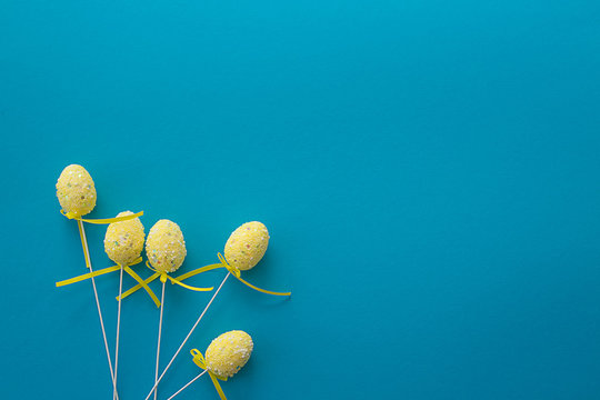 Decorative Easter Eggs On Blue Textural Background