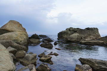 Fototapeta na wymiar Twilight on the black sea. Calm on the children's beach in Alupka. Crimea