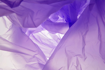 Plastic bag. Purple abstract background with uneven picture. For design, layouts and templates.