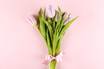 Multy purpose fresh flower composition, bouquet of purple tulips. International Women's day, mother's day greeting concept. Copy space, close up, top view, flat lay, background.