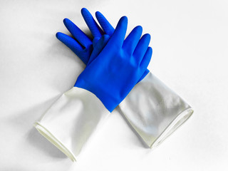 Closeup top view of beautiful blue rubber gloves on white background. housework concept. General or regular cleanup. Commercial cleaning company. household and cleaning gloves
