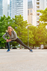 An athletic woman stretching before the workout