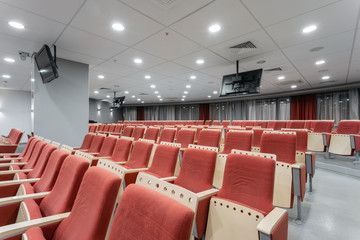 Big empty modern conference hall in luxury hotel. Audience for Speakers at Business convention and Presentation. Photo for illustration meeting, seminar, conference