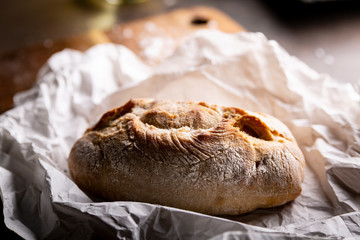 Bread. A loaf of bread with a golden crispy crust.